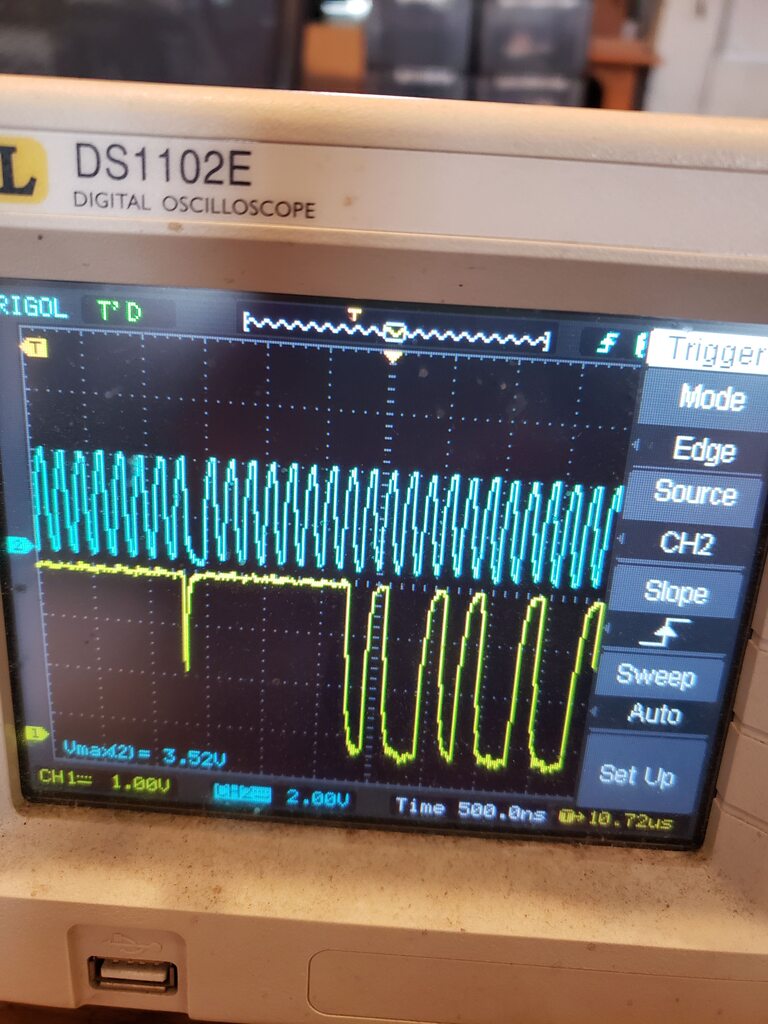 oscilliscope traces, showing a clock and a data line.